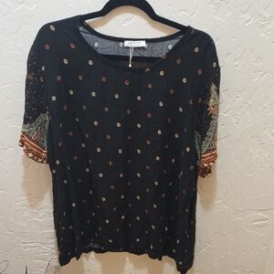 Elegant Black Top with Gold and Red Details